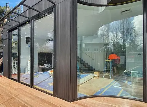 architectural curved aluminium window installation by Nuline